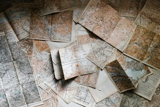 Collection of overlapping vintage maps.