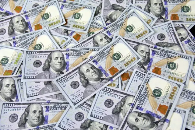 Overlapping US hundred-dollar bills.